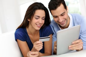 Young couple shopping online from home-1